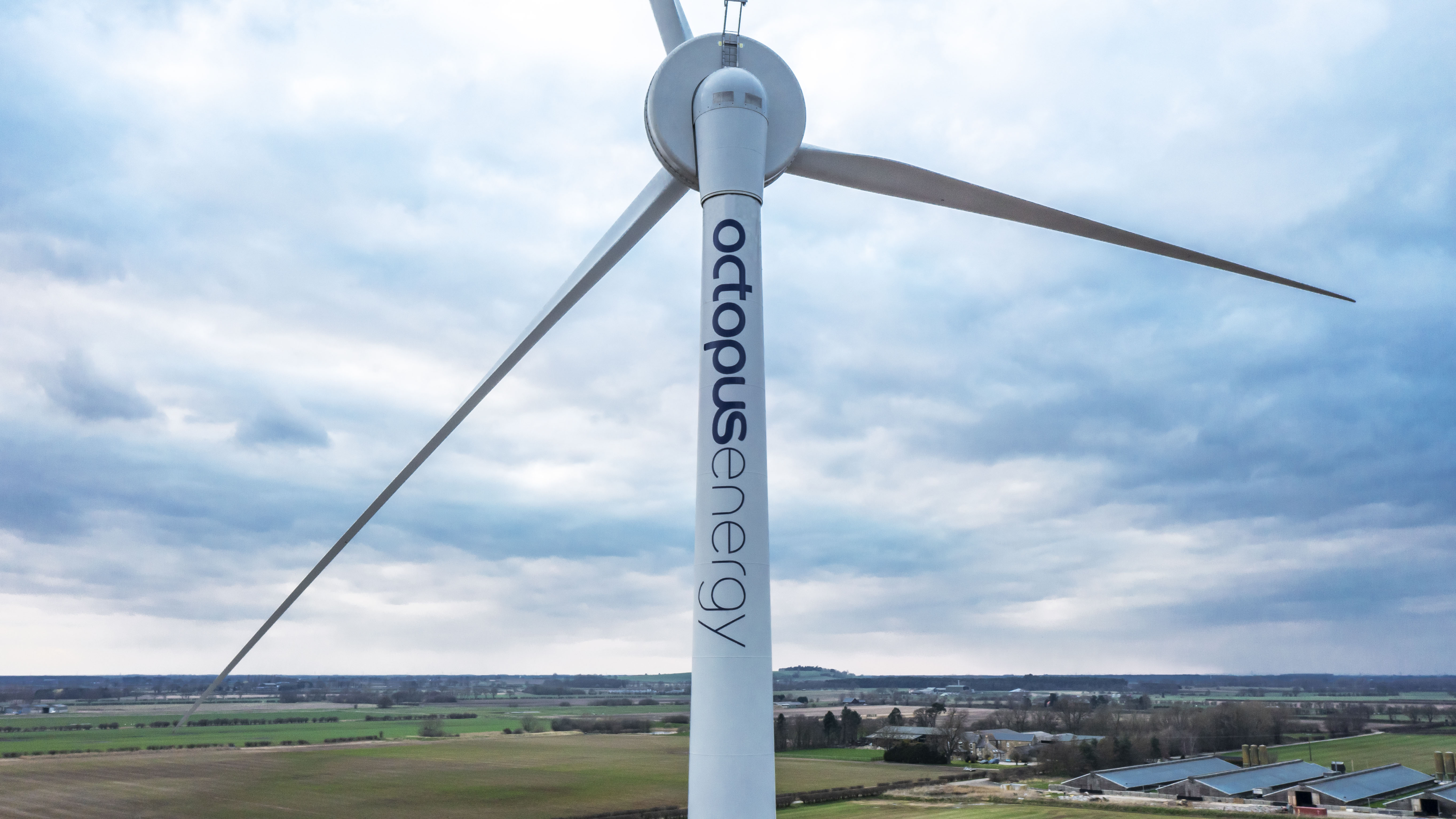 A wind turbine with the words "octopus energy" written along it